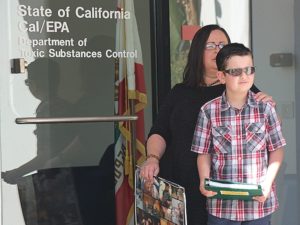 Maggie Compton and son Ryan, a leukemia survivor, deliver petition to DTSC demanding it keep SSFL cleanup promises